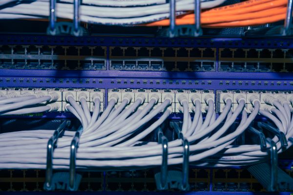 Close up on a RJ45 panel in a computer data center room